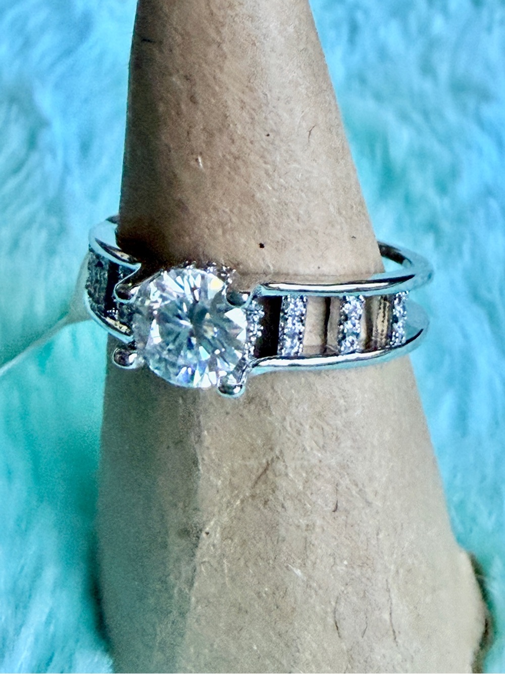 Classic Silver Solitaire Engagement Ring with Side Accent Stones - White